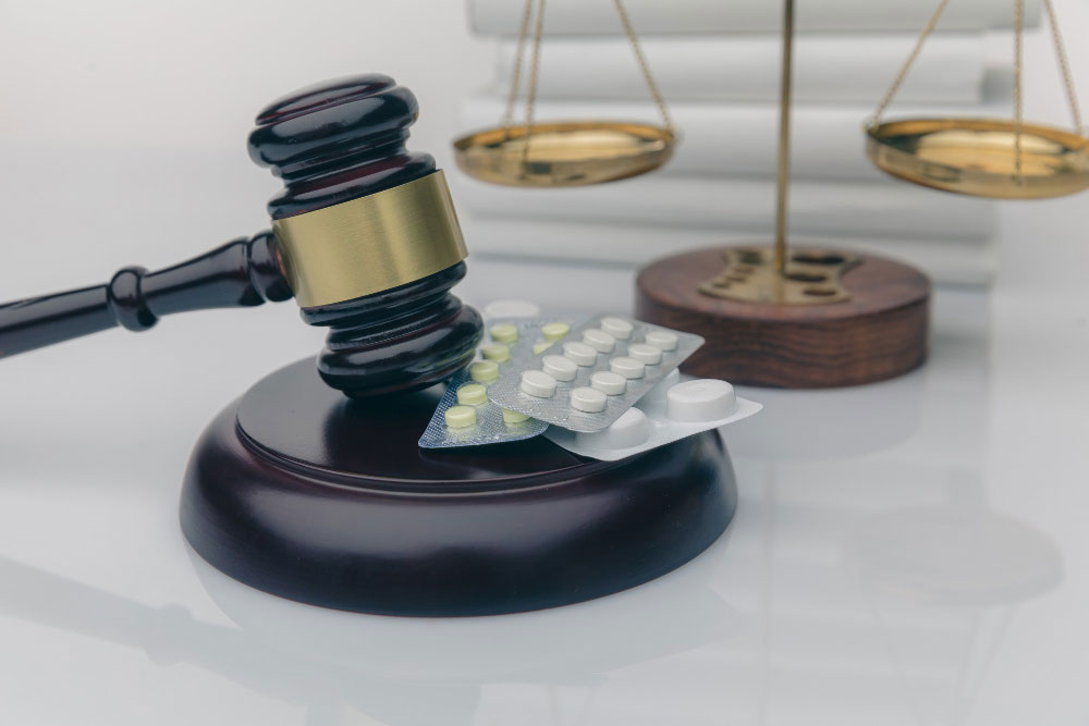A gavel with medicine beside it